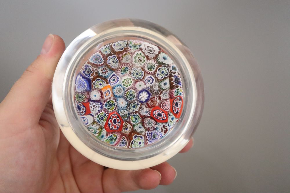 A millefiore paperweight and another paperweight
